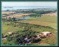 Aerial shot of farm with orchards and Percherons